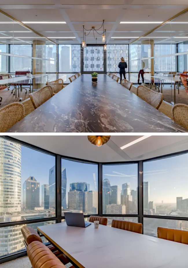 Grande table en marbre dans une salle de réunion avec vue sur les tours de La Défense